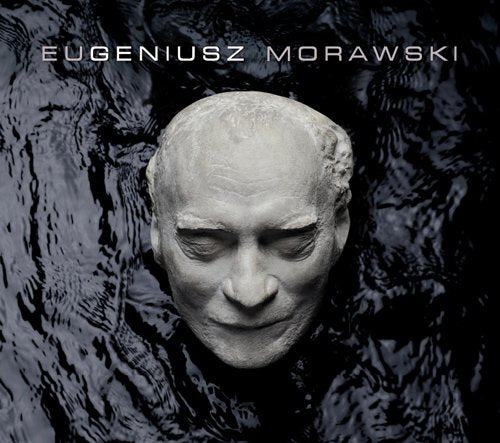 CD cover with a stone head sculpture in dark water, artist's name above.