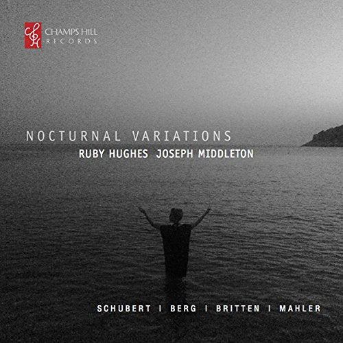 A black and white album cover with a person standing in water, arms raised.