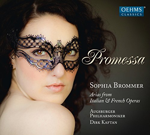 A woman wearing a black lace mask on an opera album cover.