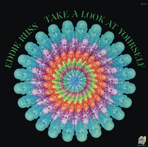 "Eddie Russ vinyl album cover with colorful skull mandala on a black background."