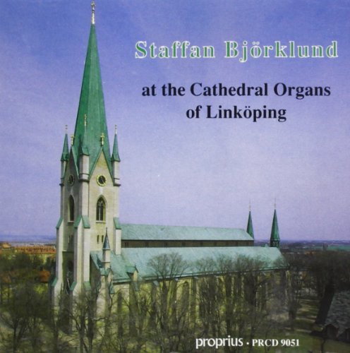"CD cover featuring a church with a tall green steeple and blue sky."