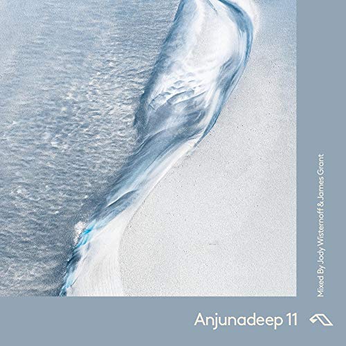 A music CD cover featuring a wave on a sandy beach with a blue-grey border.