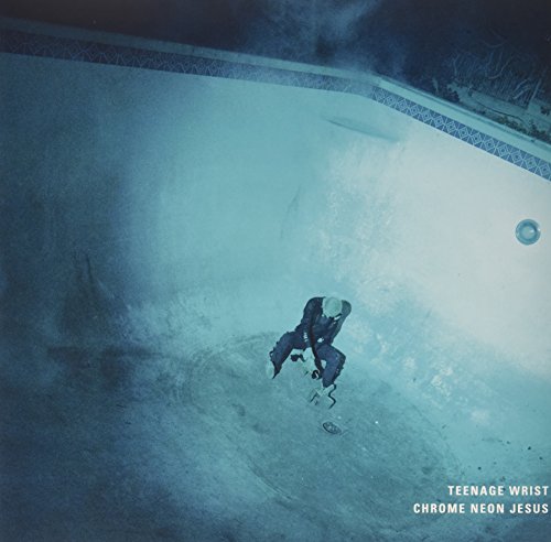 "Album cover with a person in a drained swimming pool, blue-toned image."