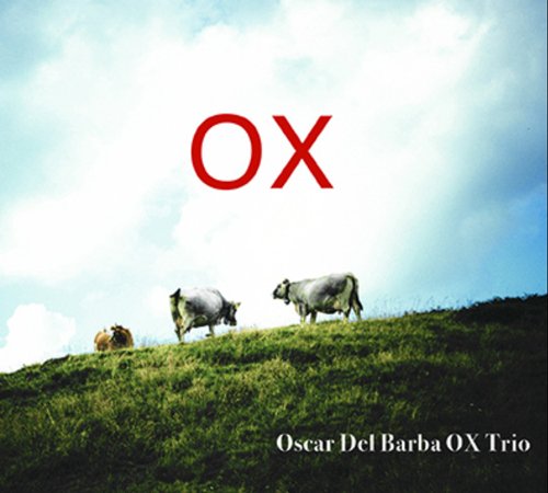 "CD cover with three cows on a grassy hill against a cloudy sky."