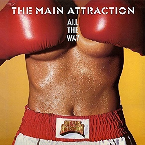 A shirtless boxer's torso with red gloves and shorts against a yellow background.