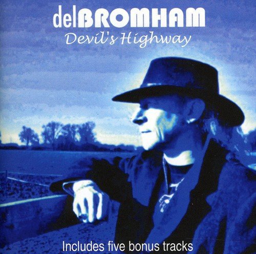 "CD cover featuring a man in a hat leaning on a fence."