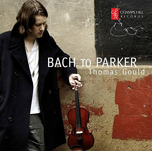 "CD cover featuring a man holding a violin against a painted concrete wall."