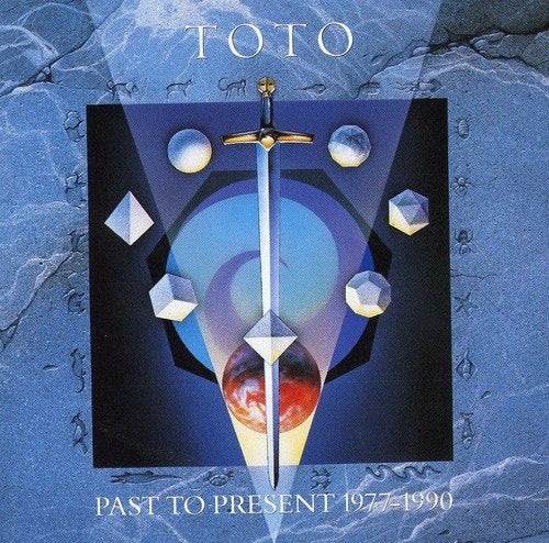 "TOTO CD and DVD cover art featuring a sword and dice on red background."