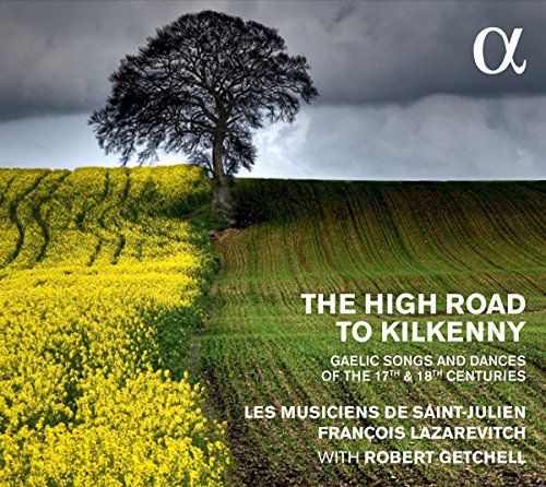 "CD cover with a tree on a hill under a cloudy sky."