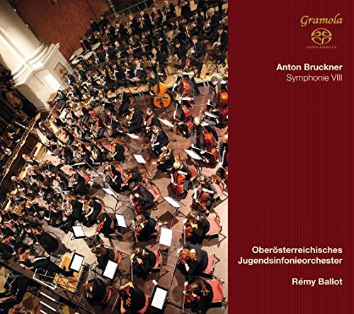 "CD cover with red panel and image of large orchestra performing."