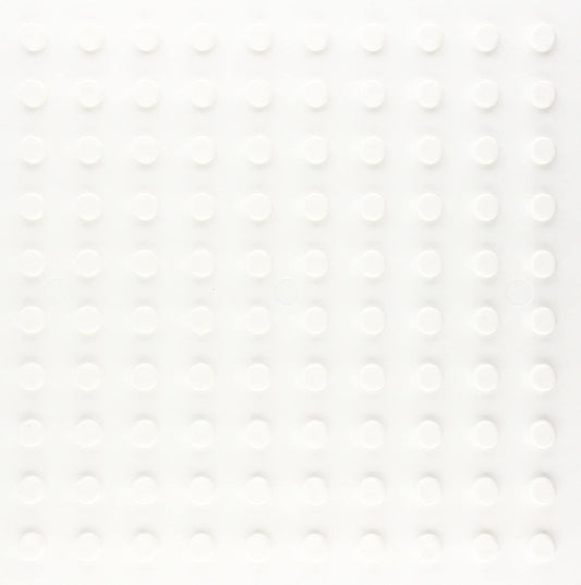 White square grid with 100 raised circular pegs, evenly spaced, on a flat surface.