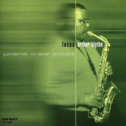 "Album cover with a man playing saxophone, green-toned image, artist and title displayed prominently."
