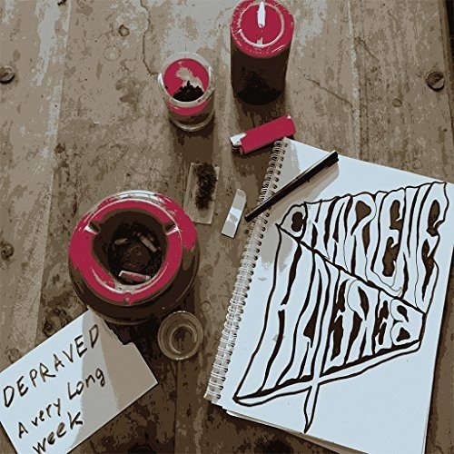 A vinyl record and album artwork on a grungy, worn wooden surface.