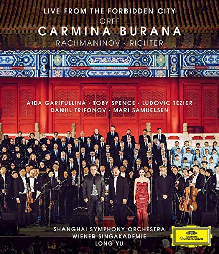 "Album cover featuring a large orchestra on stage with a red wall behind."