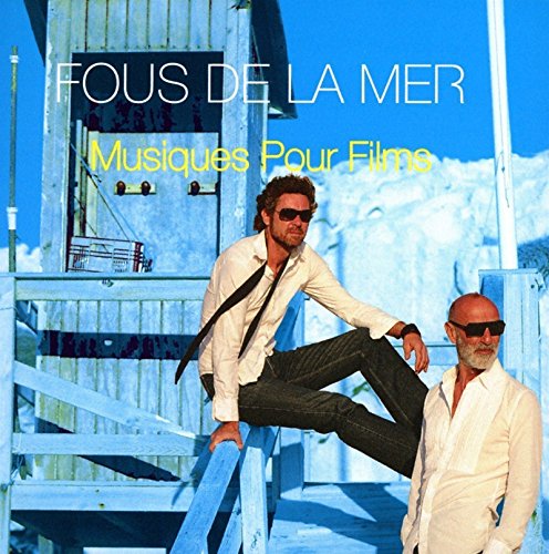 "Album cover with two men on blue stairs, white shirts, and sunglasses."