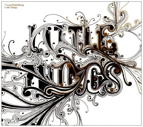 "Album cover with 'Little Things' in ornate black and gold lettering on a white background."