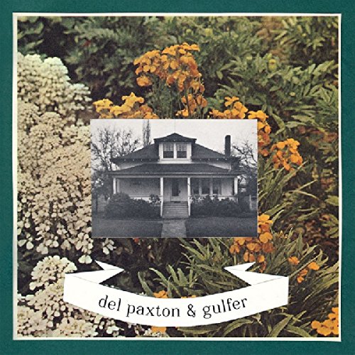 A vinyl record cover featuring a black-and-white house image surrounded by flowers.