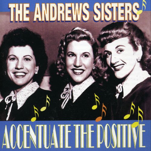 "CD cover with three smiling women and musical notes, blue banner with yellow text."