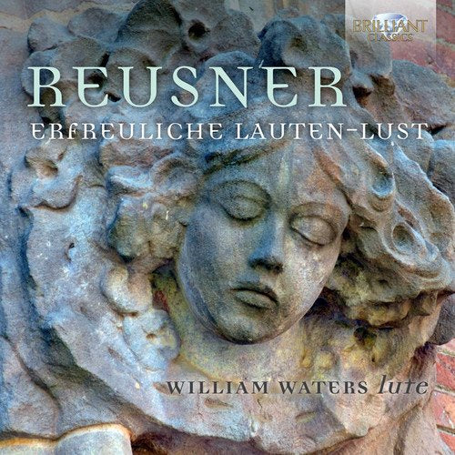 "CD cover featuring a stone carving of a serene face with closed eyes."