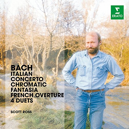 Man standing outdoors with hands on hips, album cover text on the left.