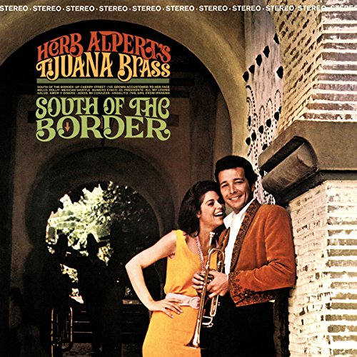 "Vinyl album cover with a man and woman standing in an arched doorway."