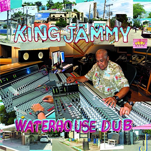 "Album cover featuring a man at a soundboard with cityscape background."