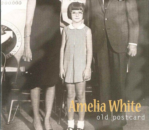 "Black and white album cover featuring a girl with two adults, partially shown."