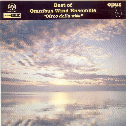 "Album cover featuring a serene lake scene at sunrise with cloudy sky and calm water."