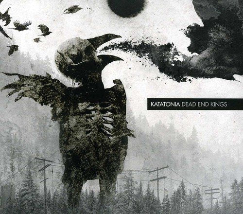 The image depicts a haunting album cover for "Dead End Kings" by Katatonia. The central figure is a large, dark, and abstract creature with a bird-like appearance, featuring a beak and outstretched wings. The creature's body is shrouded in darkness, with visible texture suggesting a mix of organic and mechanical elements. In the background, a faint landscape of trees and power lines is visible, with a gray sky above. The overall atmosphere is ominous and foreboding