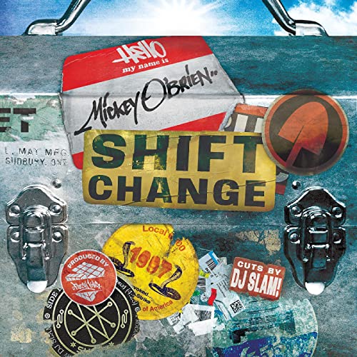 CD cover for Mickey O’Brien’s “Shift Change” with industrial, sticker-covered design.