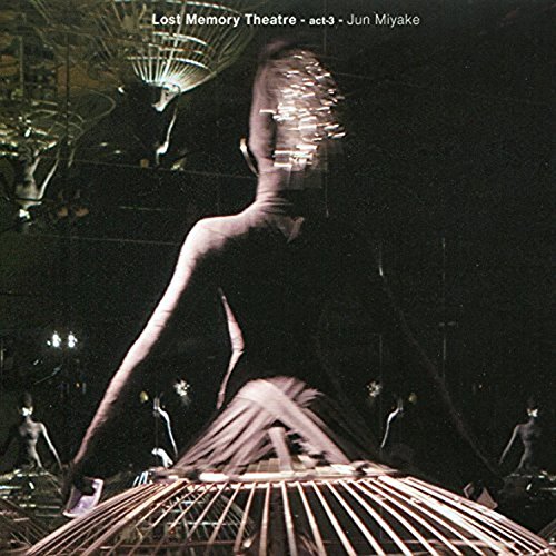 "CD cover featuring a blurred, shadowy figure with a distorted head."