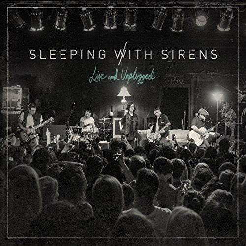 "Album cover featuring a black-and-white photo of a band performing on stage."