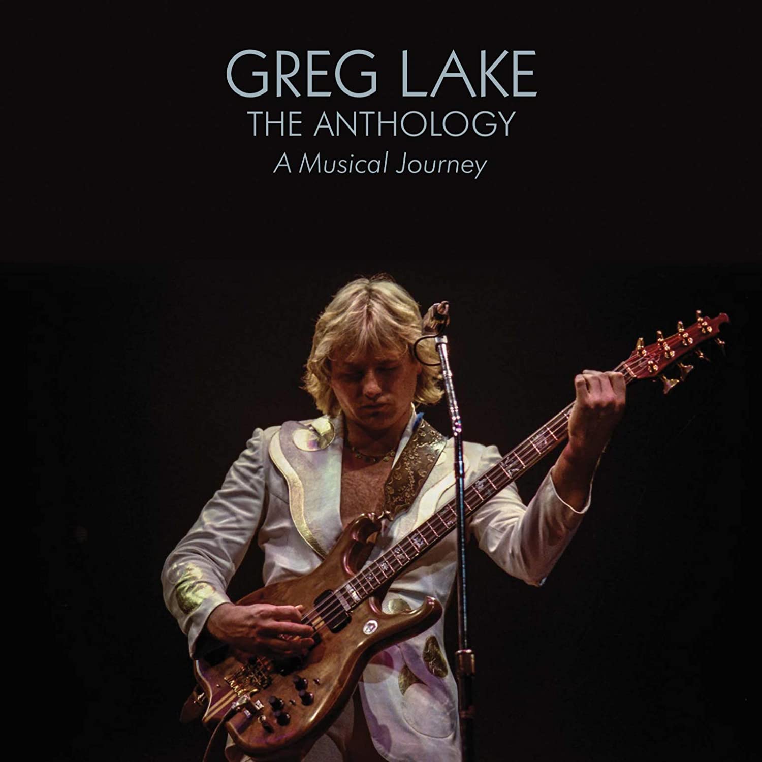 Greg Lake playing guitar on stage, CD album cover with title and description.