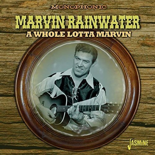 "CD cover featuring a man playing guitar, surrounded by wooden texture and text."
