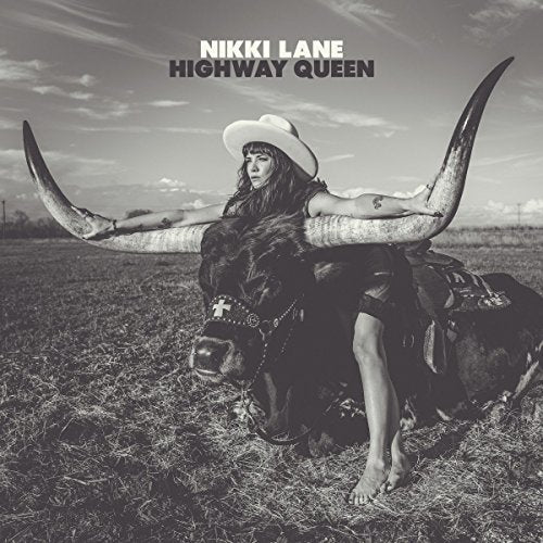 Black and white album cover featuring a woman on a longhorn in a field.