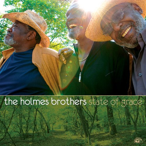 "Album cover with three older men smiling, outdoors, and a forest scene below."
