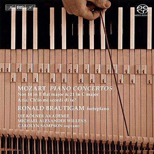 "CD cover featuring piano keys, a hand holding a conductor's baton, and white text."