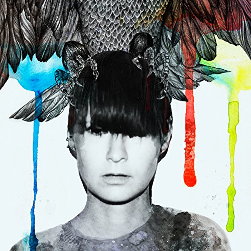 A black and white portrait of a woman with a bird on her head.