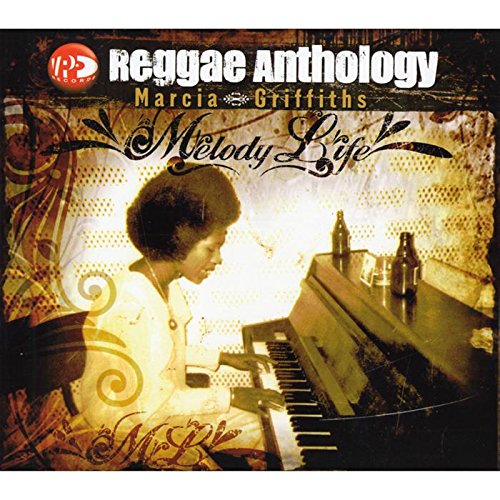 "Album cover featuring Marcia Griffiths playing piano, with 'Reggae Anthology' and 'Melody Life' text."