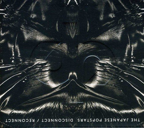 A black album cover with a large grey "jp" logo and shiny, dark fabric.