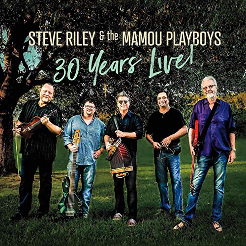 "Album cover featuring five men with instruments standing in a grassy outdoor setting."