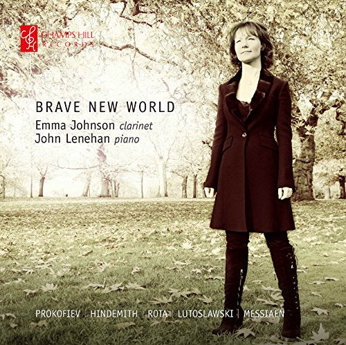 Woman in dark coat stands in a leafy park, eyes closed, on CD album cover.
