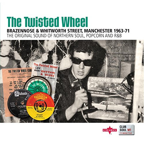 "Album cover with black and white photo, vinyl records, and green title text."