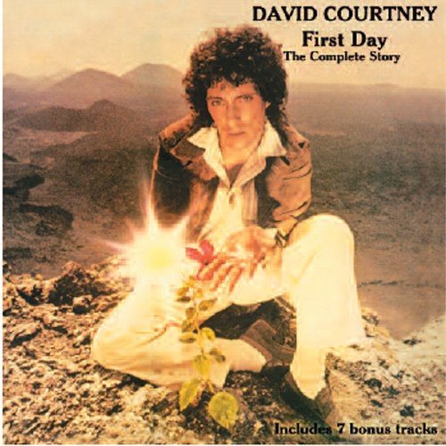"CD cover featuring David Courtney sitting on a rocky landscape with a plant."
