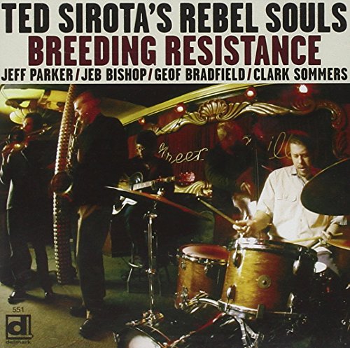 Album cover with four musicians performing on stage, with title and names listed.
