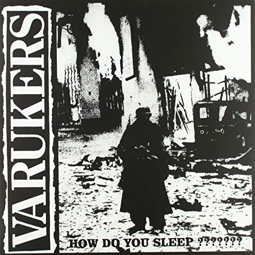Black and white album cover with a figure in a war-torn landscape.