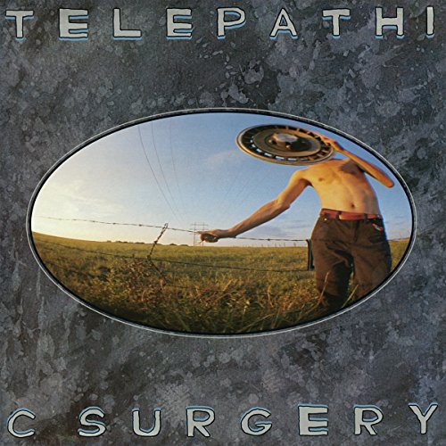 Vinyl album cover with a man holding a vinyl record above his back.