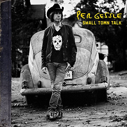 "Black and white album cover with man standing by a vintage car."