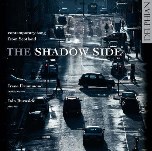 "CD cover art: city street scene with 'The Shadow Side' title and artist names."