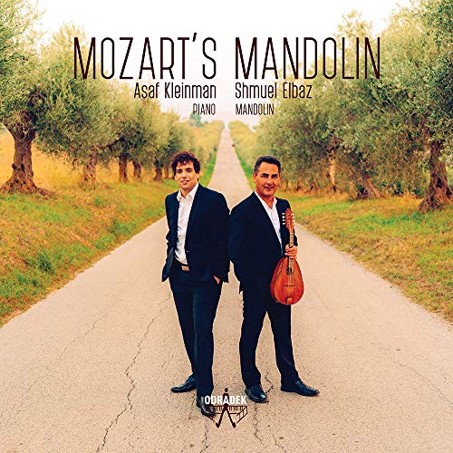 "CD cover featuring two men in suits on a tree-lined road."